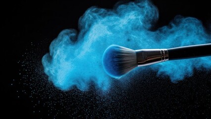 A cosmetic brush releasing a cloud of vibrant blue powder against a black backdrop