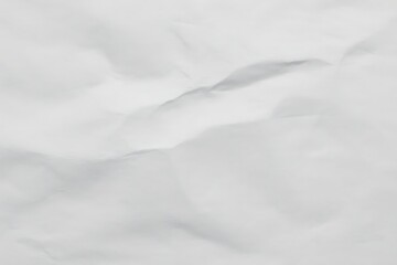 Abstract white textured background resembling snow dunes or soft fabric