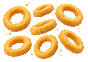 Crispy golden onion rings on black background