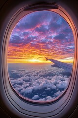 Airplane window view of stunning sunset sky with glowing clouds, vivid orange and purple tones above the horizon