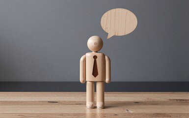 Wooden businessman figure stands alone, speech bubble above head, minimalist office setting.