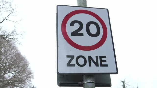 4K: 20mph Speed Zone Warning Sign in the United Kingdom. Traffic safety restriction. Stock Video Clip Footage
