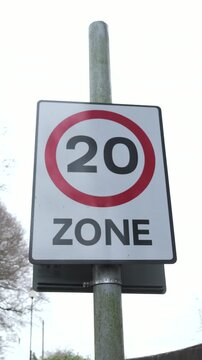 4K: 20mph Speed Zone Warning Sign in the United Kingdom. Traffic safety restriction. Vertical. Stock Video Clip Footage