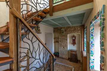 Rustic Interior with Wooden Staircase, Brick Wall and Vintage Clock
