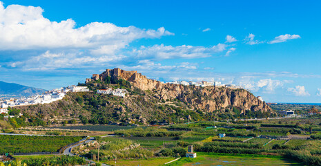 White-washed houses and castle overlooking the sea in Salobre&ntilde;a, Andalusia, Spain. Granada Province
