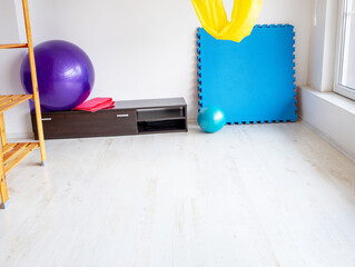 Minimal fitness studio with exercise mats and stability balls