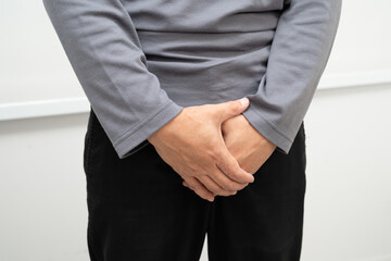 Hernia, Asian man stomach ache, abdominal pain and urology problem health.