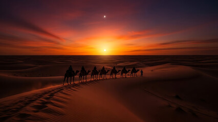 A majestic camel caravan moves across the vast desert landscape under a breathtaking, fiery orange sunset sky.