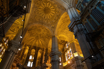 Naklejka premium Intricate ceiling and stained glass in cathedral.. Cathedral of Malaga, Spain