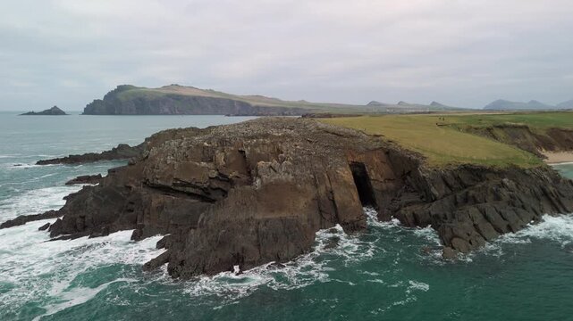 Scenic 4K aerial video of flying above spectacular Atlantic coastline, with picturesque rocks, cliffs and islands, Sybil head, Dingle Peninsula, Kerry, Ireland