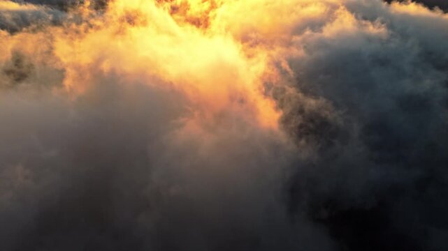 Dramatic sunset clouds with vibrant colors, captured in aerial view