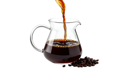 Brewed coffee pouring into a glass carafe, with spilled beans isolated on a dark background