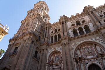 Tall cathedral tower with intricate architectural details.. Cathedral of Malaga, Spain