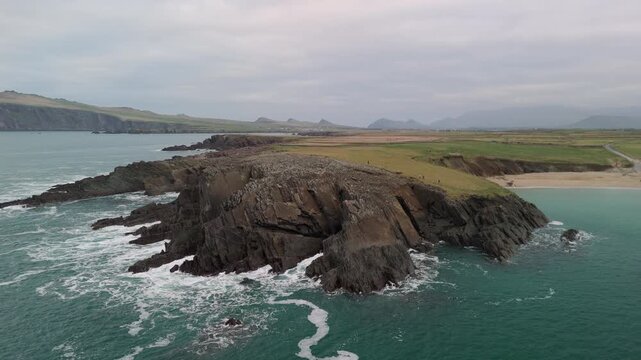 Scenic 4K aerial video of flying above spectacular Atlantic coastline, with picturesque rocks, cliffs and islands, Sybil head, Dingle Peninsula, Kerry, Ireland