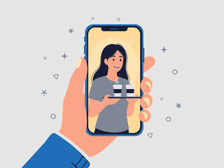 A hand holding a smartphone with a woman on the screen and stars around it