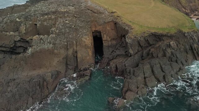 Scenic 4K aerial video of flying above spectacular Atlantic coastline, with picturesque rocks, cliffs and islands, Sybil head, Dingle Peninsula, Kerry, Ireland