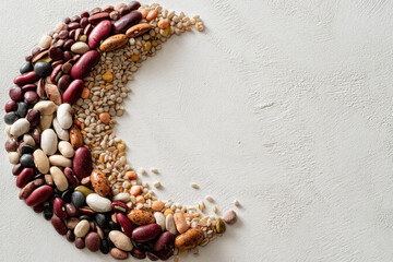 Rice, White, Crescent Shape Created with Diverse Beans on Textured Surface for Creative Culinary