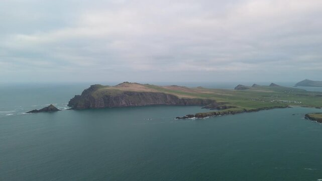 Scenic 4K aerial video of flying above spectacular Atlantic coastline, with picturesque rocks, cliffs and islands, Sybil head, Dingle Peninsula, Kerry, Ireland