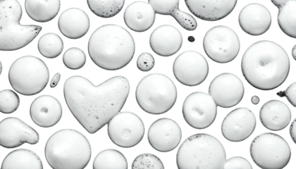 Close-up of frothy white soap bubbles on a black background, various shapes and sizes