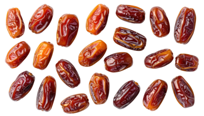 Close-up of numerous dates against a black backdrop, showcasing their textured skin and vibrant colors