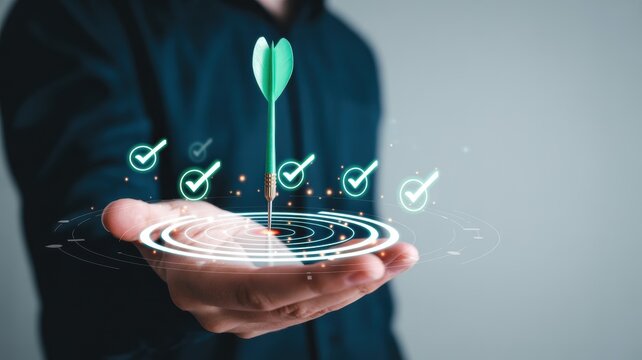 Successful business strategy concept: person holding a dart on a digital target with checkmarks