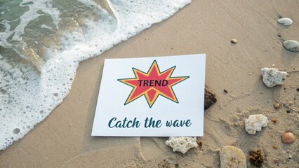 White card on sandy beach with the trend word