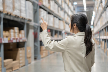 female business owner using digital tablet check amount of stock product inventory on shelf at distribution warehouse factory.logistic business ship and delivery, inventory flow, professional.