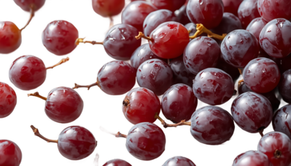 A vibrant cluster of red grapes against a dark background