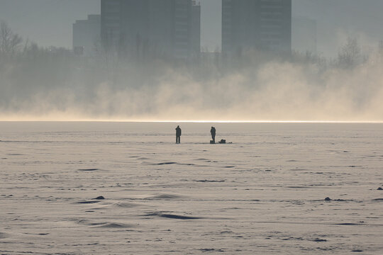 winter fishing on the ice of the reservoir