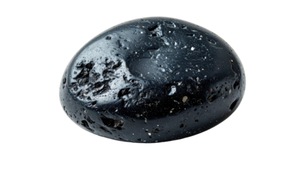 Close-up studio shot of a smooth, dark, volcanic rock isolated on a black background