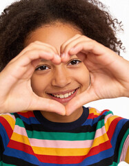 Closeup portrait of beautiful young african american woman making heart with hands