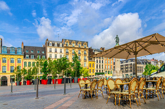 Street restaurant tables and chairs on La Grand Place square in Lille city center, Flemish mannerist architecture style buildings, Column of Goddess, French Flanders, Nord department, Northern France