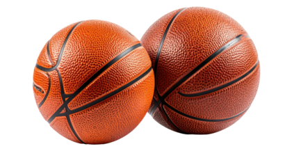 Close-up studio shot of two textured, orange and brown spheres, commonly used in sport