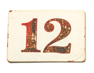 Vintage distressed house number 12 sign plate with rust patina and worn typography label cutout on isolated background