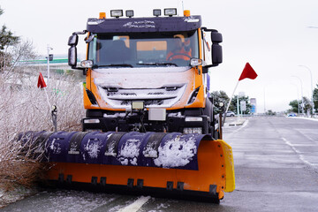 snowplow clearing snow from roads