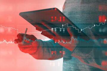 Silhouette of professional using tablet device with stylus combined with red blue teal financial charts and digital grid patterns. Innovation visualization and business analytics.