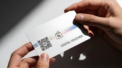 Hands holding digital gift voucher card.