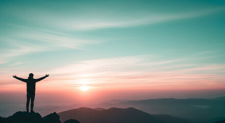 Silhouette of a Person with Open Arms Against a Sunset: Achieving Goals, over Mountains, Hope, Freedom