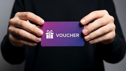 Person holding purple gift voucher card.