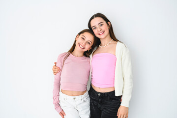 Two cute and Young pre teen girl on studio white