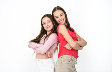 Two cute and Young pre teen girl on studio white