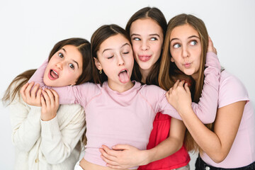 four Teenagers Girlfriends on studio white background