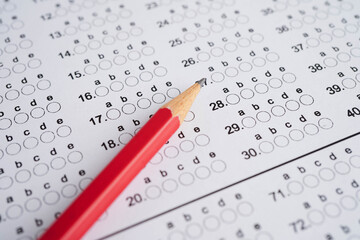 Answer sheets with pencil drawing fill to select choice, education concept.