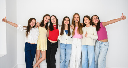 Group Of Teenage Girlfriends on studio white background