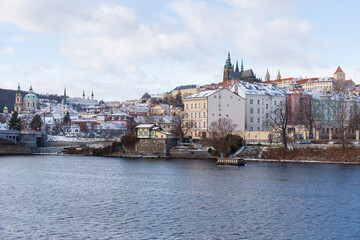 Fototapeta premium Snowy Prague Lesser Town with gothic Castle, Czech Republic 