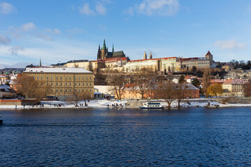 Obraz premium Snowy Prague Lesser Town with gothic Castle, Czech Republic 
