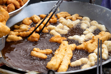 Freshly fried youtiao&mdash;golden, crisp, and airy
