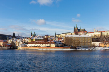 Fototapeta premium Snowy Prague Lesser Town with gothic Castle, Czech Republic 