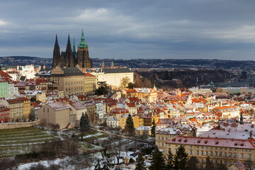 Fototapeta premium Snowy Prague Lesser Town with gothic Castle from Hill Petrin, Czech Republic 