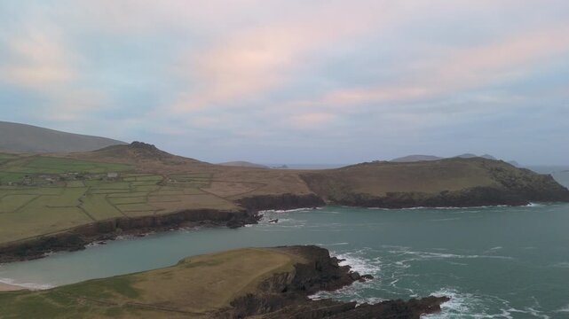 Scenic 4K aerial video of flying above spectacular Atlantic coastline, with picturesque rocks, cliffs and islands, Sybil head, Dingle Peninsula, Kerry, Ireland